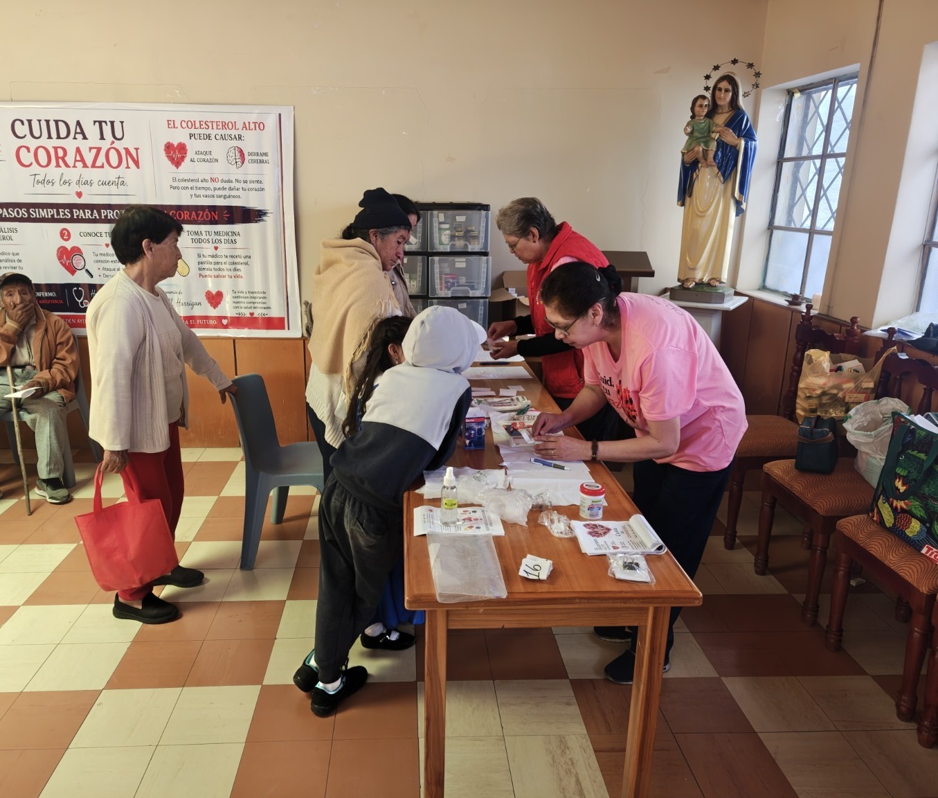 Health professionals organizing a community screening in Ecuador